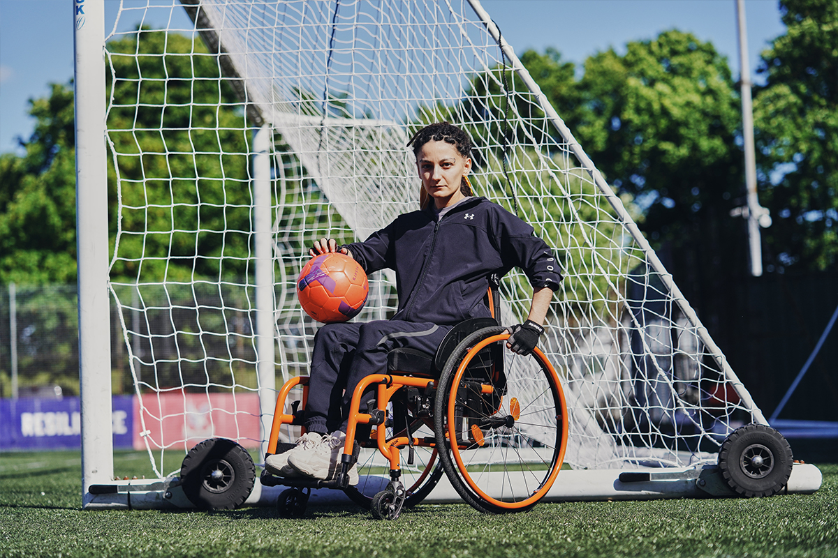 Player in a wheelchair with a football
