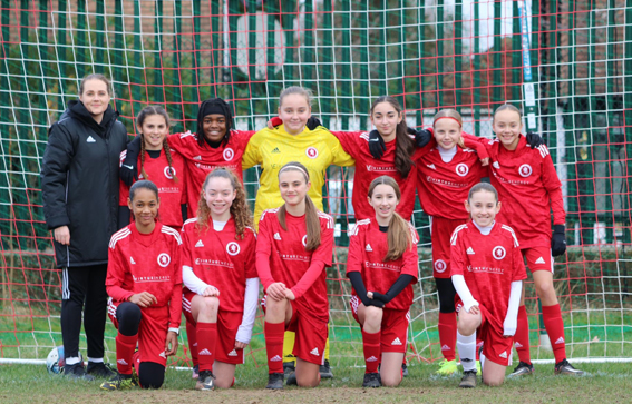 Hollie Varney with girls football team 